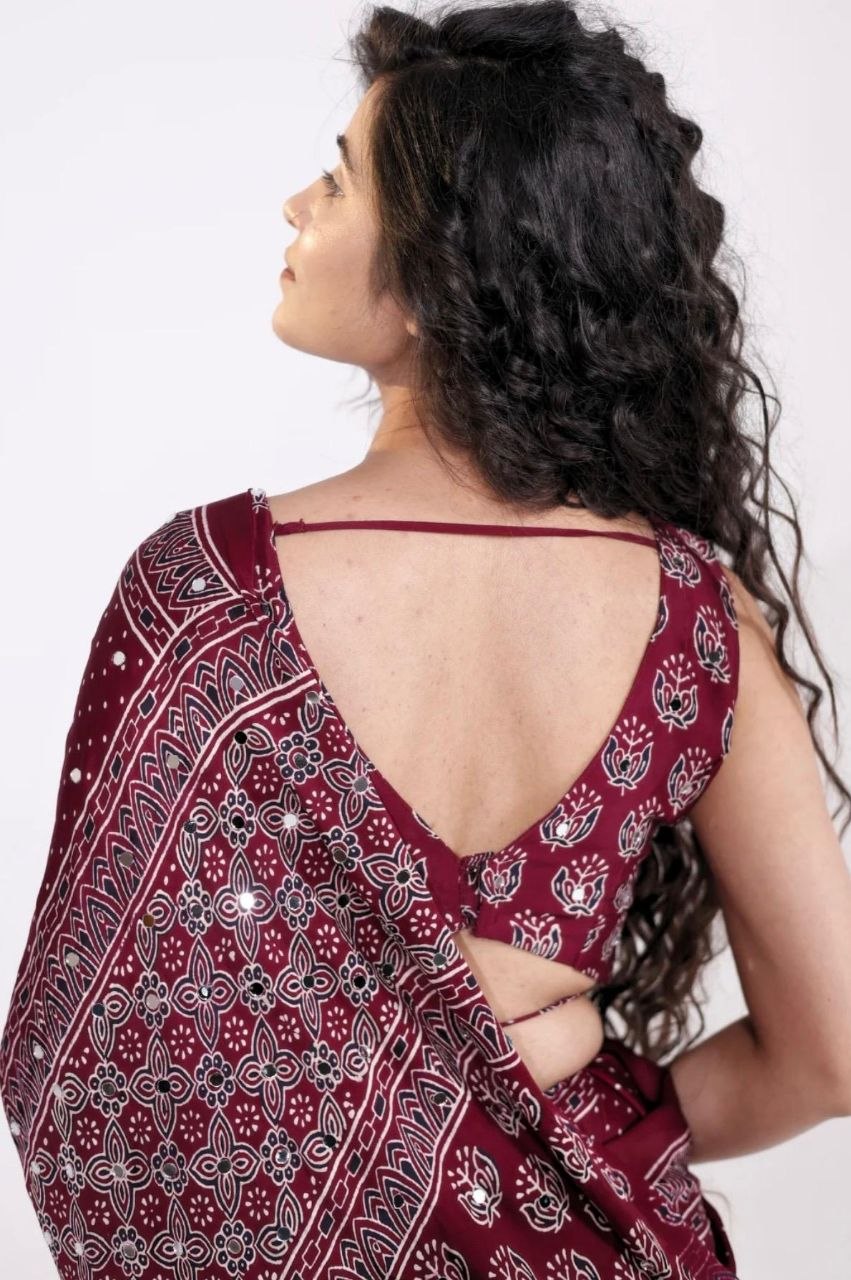 Maroon Ajrakh Print Mirror Work Saree With Designer Border & Tassels With Matching Blouse Piece
