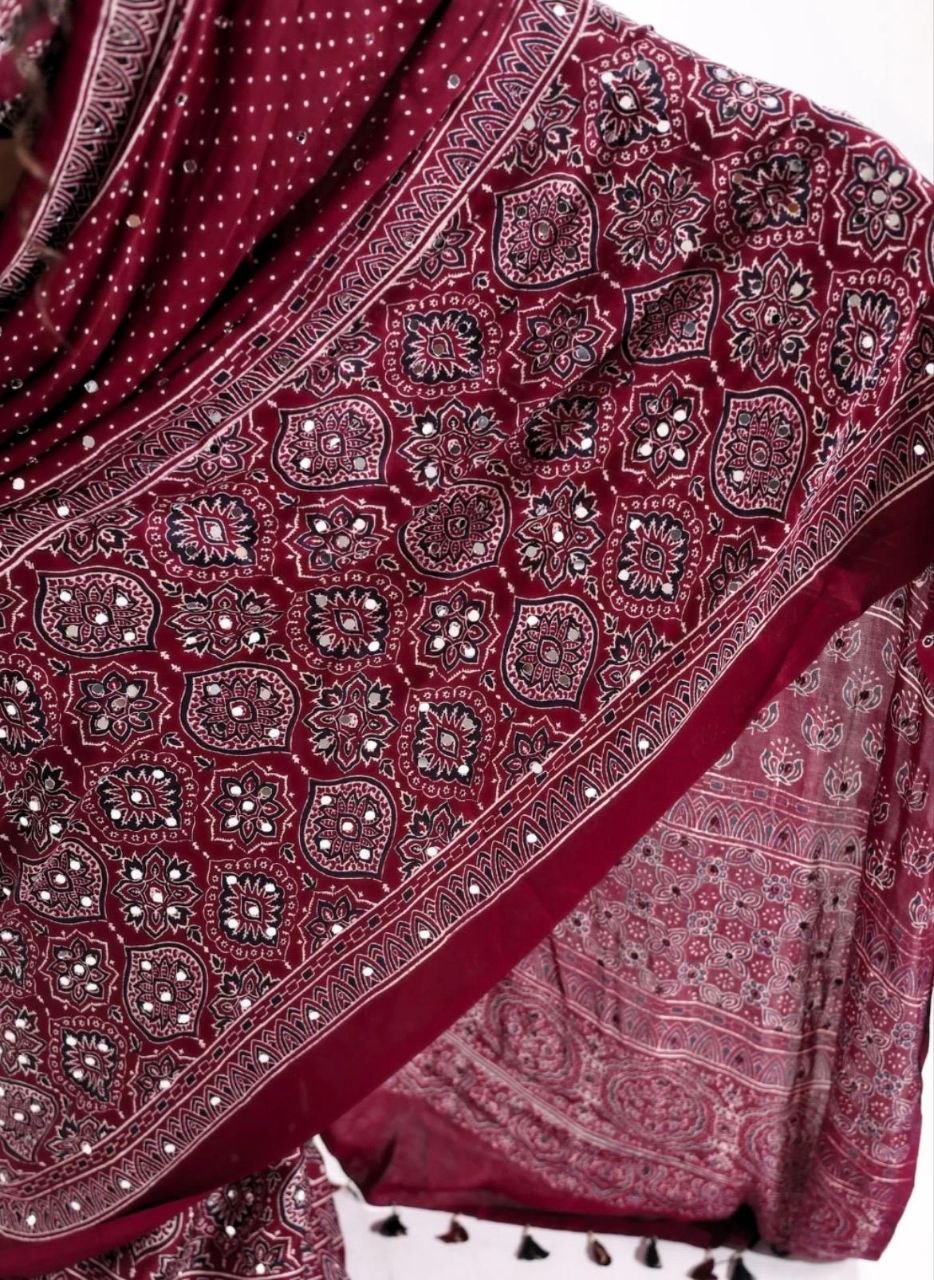 Maroon Ajrakh Print Mirror Work Saree With Designer Border & Tassels With Matching Blouse Piece